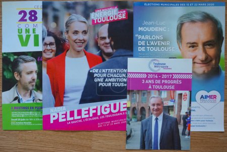 Photo for Toulouse, France - June 2020 - Election pamphlets featuring the main candidates for mayor in Toulouse : ecologist Antoine Maurice, socialist Nadia Pellefigue and centre-right Jean-Luc Moudenc - Royalty Free Image