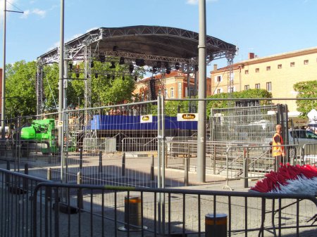 Photo for Albi, France -May 4, 2017- Fences and metal stage with spotlights set up in Vigan Square to accomadate Emmanuel Macron for his outdoor meeting ; it was his last election rally before the second ballot - Royalty Free Image
