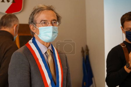 Photo for Crest, France - Oct. 2021 - Mayor of Crest Herv Mariton, former Minister, conservative ex-member of the National Assembly, wearing a tricolor sash, presiding a civil wedding ceremony at the town hall - Royalty Free Image