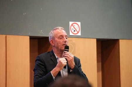 Photo for Toulouse, France - March 2023 - Colonel Philippe Perrin, city councillor, ex-spationaut, test pilot with the French Air Force and with Airbus, speaks at a debate on the local low emission zone - Royalty Free Image