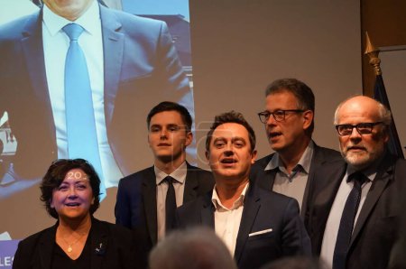 Photo for Reims, France - Nov. 2022 - Les Republicains leaders chanting the national anthem, including ex-MP Valerie Beauvais, deputy mayor Stephane Lang and secretary of the Young Republicans Theo Michel - Royalty Free Image