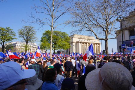 Photo for Paris, France - March 27, 2022 - Large crowd of presidential candidate Eric Zemmour's supporters, waving French flags, at his giant rally on the Trocadero Esplanade, behind the Chaillot Palace - Royalty Free Image