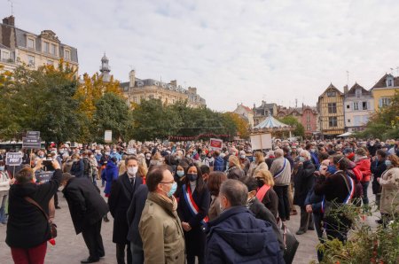 Photo for Troyes, France - Oct. 18, 2020 -Hundreds of people gathering in front of the city hall in tribute to Samuel Paty, a teacher beheaded by an islamist terrorist for showing Charlie's cartoons of Mohammed - Royalty Free Image
