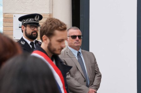 Photo for Toulouse, France - April 2023 - With other officials, far-left member of the National Assembly Francois Piquemal observes a moment of silence during the commemoration of the 1915 Armenian genocide - Royalty Free Image