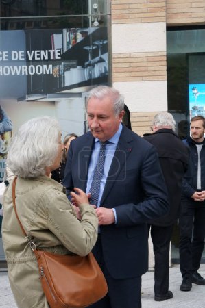 Photo for Toulouse, France - April 2023 - Mayor-president of Toulouse and Toulouse Metropole Jean-Luc Moudenc has a chat on the street with an elderly woman, after the commemoration of the Armenian genocide - Royalty Free Image