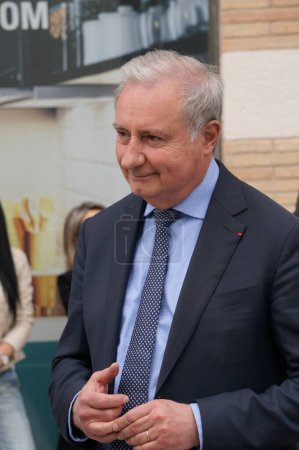 Photo for Toulouse, France - April 2023 - Mayor-president of Toulouse and Toulouse Metropole Jean-Luc Moudenc has a chat on the street with an elderly woman, after the commemoration of the Armenian genocide - Royalty Free Image