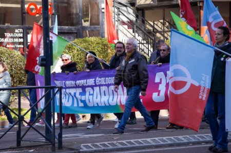 Photo for Toulouse, France - Feb. 2023 - Demonstrators from trade unions or left-wing political parties opposing the government's pension reform (socialists and communists), gathering on Arnaud-Bernard Square - Royalty Free Image