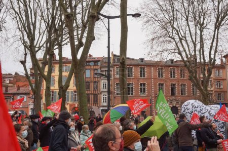 Photo for Toulouse, France - Jan. 30, 2021 - Crowd of pro-family protesters waving flags at Marchons Enfants demonstration - Royalty Free Image