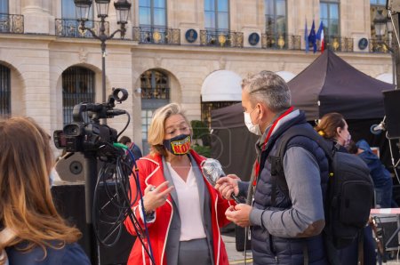 Photo for Paris, France - Oct. 10, 2020 - Ludovine de la Rochre, President of La Manif Pour Tous (LMPT), is interviewed by the French media at Marchons Enfants' demonstration against the bioethics bill - Royalty Free Image