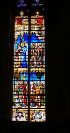 Photo for Toulouse, France - Jan. 2020 - Colorful stained glass window in the Cathedral of Saint Stephen (Saint-tienne) picturing religious scenes involving clergymen, Biblical and historical characters - Royalty Free Image