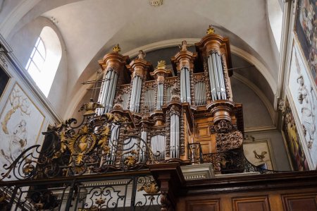 Photo for Toulouse, France - March 2020 - Imposing loft organ on the grandstand of the baroque church of Saint-Pierre des Chartreux (Saint Peter of the Carthusian monastery), featuring richly carved wood - Royalty Free Image