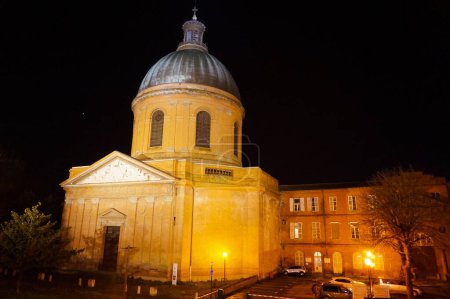 Photo for Night view of Saint-Joseph de La Grave's Chapel ; this famous landmark of Toulouse, France, built of brick in the 19th century, features a copper dome topped by a roof lantern and a triangular fronton - Royalty Free Image