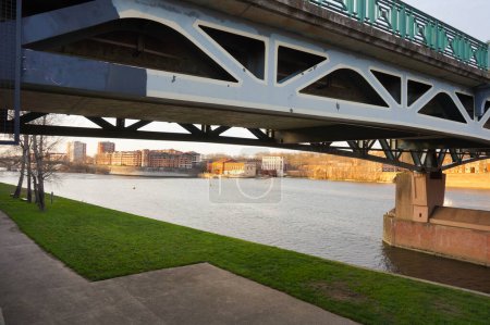 Photo for Bottom view of the prestressed concrete beams and piers of Pont d'Empalot, a girder bridge in Toulouse, France, crossing the River Garonne and supporting the six-lane express way of Toulouse ring road - Royalty Free Image