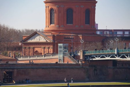 Photo for Low angle view of 19th century Saint Joseph de La Grave's Chapel; this terracotta brick church located in Saint-Cyprien, in Toulouse, France, features a copper dome topped with a roof lantern - Royalty Free Image