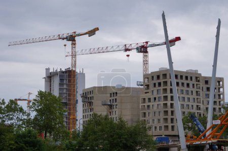 Photo for Toulouse, France - May 2023 - Worksite of Passerelle Empalot, future suspended footbridge to link Ramier Island to Empalot, crossing above the River Garonne; the two cable pylons are already erected - Royalty Free Image