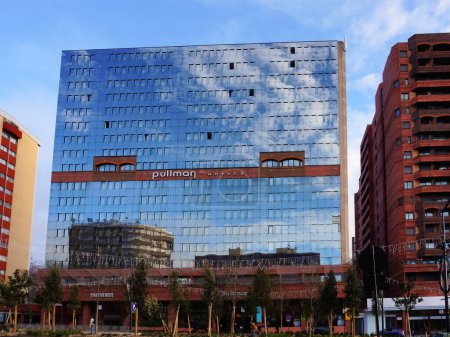 Photo for Toulouse, France - Dec. 2019 - Buildings including one with glass facade and brick ornaments, housing luxury hotels (Adagio Aparthotel and Pullman Hotels) in the "Ramblas of Alles Jean Jaurs" - Royalty Free Image
