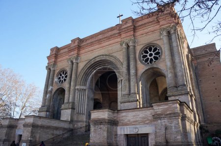 Photo for Toulouse, France - Feb. 2023 - Facade and arched entrance of Saint-Aubin's Church, a 19th century edifice that mixes Romanesque, Byzantine and Gothic art, in the district of Saint-Aubin-Dupuy - Royalty Free Image