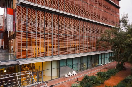Photo for Toulouse, France - Dec. 2019 - Modern facade of Jose Cabanis Media Center, which houses Toulouse's main library, featuring brick cladding as louvered shutters to provide shade to the glass walls - Royalty Free Image