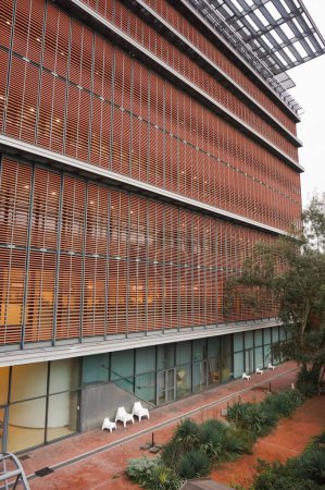 Photo for Toulouse, France - Dec. 2019 - Modern facade of Jose Cabanis Media Center, which houses Toulouse's main library, featuring brick cladding as louvered shutters to provide shade to the glass walls - Royalty Free Image