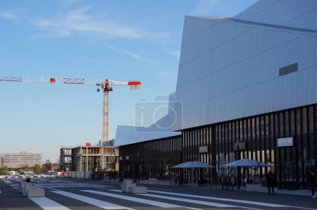 Photo for Toulouse, France - May 2023 - Modern UGC multiplex cinema and commercial center in the new business centre of Montaudran Aerospace; afar, another complex by GA Smart Building is under construction - Royalty Free Image