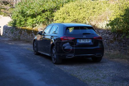 Photo for Occitanie, France - Aug. 14, 2023 - Rear of a black, 2018 Mercedes-Benz A Class with 2 exhausts; the A Class is a compact executive car by German manufacturer Daimler, that uses French Renault motors - Royalty Free Image