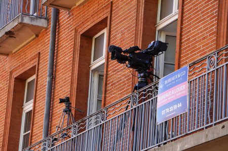 Photo for Toulouse, France - Aug. 31, 2023 - Structure relocation of Franois Verdier War Memorial for the construction of metro Line C: TV cameras placed on a balcony above the work site to film the event - Royalty Free Image