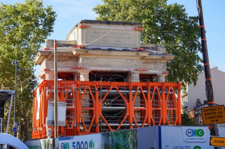 Photo for Toulouse, France - Aug. 31, 2023 - Structure relocation of Franois Verdier War Memorial for the construction of metro Line C: the triumphal arch before its rotation, enclosed in a metal exoskeleton - Royalty Free Image