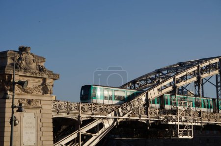 Photo for Paris, France - Sept. 5, 2023 - A metro on Line 5 passes by Austerlitz Viaduct, a railway, metal bow bridge which crosses the Seine River, near Paris-Austerlitz Train Station in the 13th district - Royalty Free Image