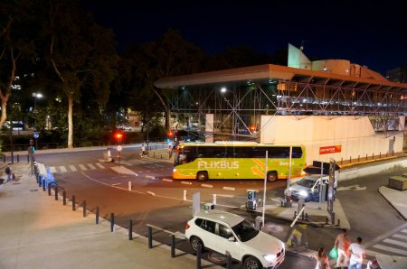 Photo for Toulouse, France - Sept. 4, 2023 - A Flixbus coach departs by night from Gare routire Pierre Smard, next to Matabiau Train Station, a bus terminal for city buses, national and international coaches - Royalty Free Image