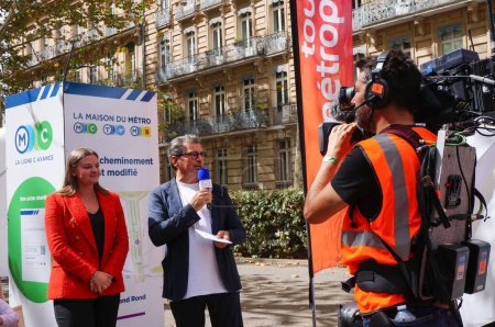 Photo for Toulouse, France - Aug. 31, 2023 - Structure relocation of Franois Verdier War Memorial for the construction of metro Line C: city councillor Nina Ochoa is interviewed by journalist Bruno Mallet - Royalty Free Image