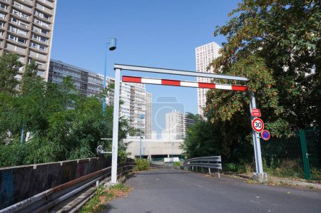 Photo for Paris, France - Sept. 5, 2023 - Entrance gate for the trucks serving the underground logistic platform of Gobelins-Olympiades, which dispatches goods to Asian businesses in the 13th district Chinatown - Royalty Free Image