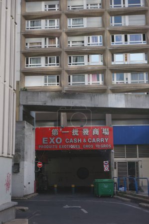 Photo for Paris, France - Sept. 5, 2023 - Trucks entrance to the underground storage center of Paris Store's site on Ivry Avenue, in the 13th district's Chinatown; Paris Store is a chain of Asian supermarkets - Royalty Free Image