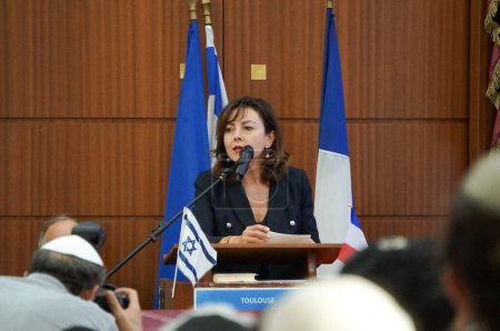 Photo for Toulouse, France - Oc. 12, 2023 - Hamas attacks in Israel: Carole Delga, president of Occitanie Region, former minister, gives a speech in homage to the victims at Hekhal David Great Synagogue - Royalty Free Image