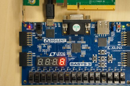 Photo for Toulouse, France - July 2, 2023 - Digilent Basys 3, an FPGA board compatible with Xilinx university program, equipped with 4 seven-segment displays, switches, buttons, VGA slot and USB HID host - Royalty Free Image