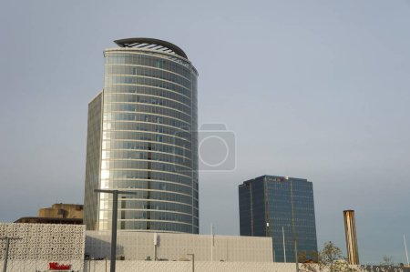 Photo for Lyon, France - Nov. 24, 2023 - Next to Wesfield Shopping Mall in the forefront, Tour Oxygne and the older Tour Swiss Life, two glass office towers in La Part-Dieu Central Business District (CBD) - Royalty Free Image