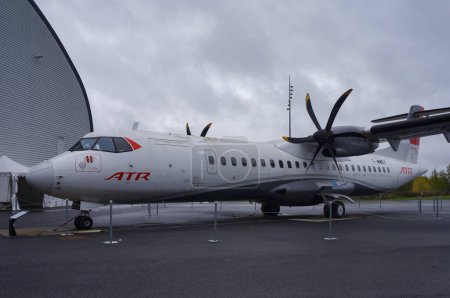Photo for Toulouse, France - Nov. 21, 2023 - An ATR 72 on the tarmac at Blagnac Airport; ATR (Regional Transport Airplanes) is a French-Italian manufacturers that produces short-haul turboprop aircrafts - Royalty Free Image