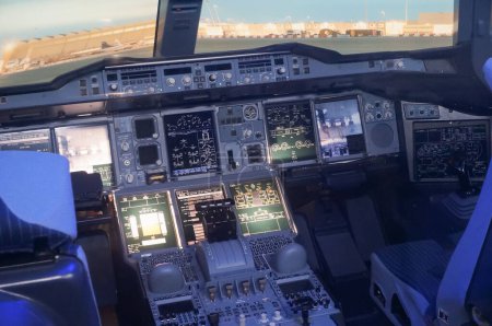 Photo for Toulouse, France - Nov. 21, 2023 - Cockpit with fly-by-wire control systems inside an Airbus A380; this jumbo jet, the largest worlwide, was produced by French-European aircraft manufacturer Airbus - Royalty Free Image
