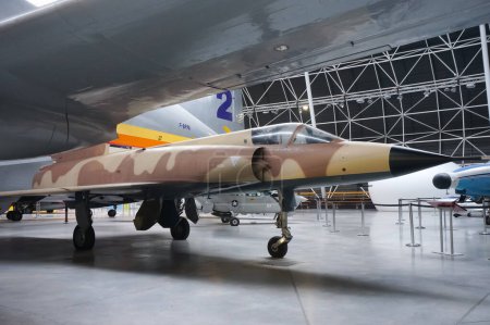 Photo for Toulouse, France - Nov. 21, 2023 - An old Dassault Mirage F1 in African camouflage, exhibited at Aeroscopia Museum; this former fighter jet was in service in the French Air Force until the 2010s - Royalty Free Image