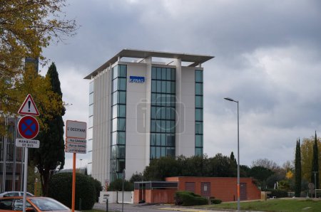 Photo for Labge, France - Dec. 2, 2023 - Modern glass KPMG Tower in Labge Palays business park, next to Toulouse; KPMG is one of the largest accounting organizations worldwide, headquartered in London - Royalty Free Image
