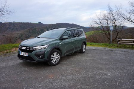 Photo for Ambialet, France - Jan. 28, 2024 - A Dacia Jogger parked on a viewing area by the road to Ambialet, in the Tarn Valley; it is an MPV, estate car produced in Romania by French manufacturer Renault - Royalty Free Image