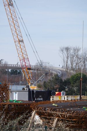 Photo for Labge, France - Feb. 18, 2024 - A track-laying crawler crane, with a yellow steel boom, on the construction site of the extension of Toulouse's Metro Line B, near INPT-ENSIACET Lake in Le Palays - Royalty Free Image