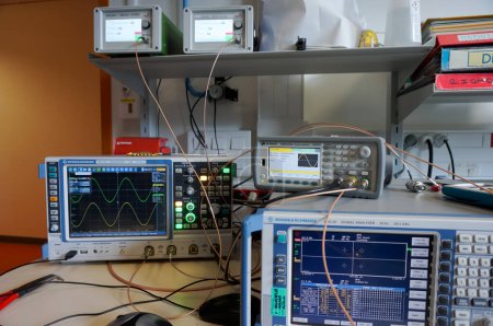 Photo for Toulouse, France - Jan. 5, 2024 - RF laboratory at ISAE-SUPAERO: experimental setup for QPSK modulation, comprising 2 oscilloscopes, a spectrum analyzer, a waveform generator, frequency synthesizers - Royalty Free Image