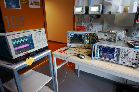 Toulouse, France - Jan. 5, 2024 - RF laboratory at ISAE-SUPAERO: experimental setup for QPSK modulation, comprising 2 oscilloscopes, a spectrum analyzer, a waveform generator, frequency synthesizers