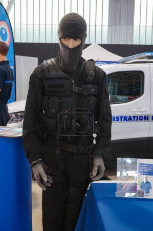 Photo for Aussonne, France - April 19, 2024 - Mannequin of a hooded officer with ERIS, the elite intervention unit with the Prison Administration of the French Ministry of Justice, exhibited at Toulouse Fair - Royalty Free Image