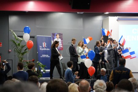 Photo for Toulouse, France - April 27, 2024 - Head of Haute-Garonne Les Republicains branch, Christine Gennaro-Saint, gets on stage to open MEP F.-X. Bellamy's election rally, acclaimed by young party members - Royalty Free Image