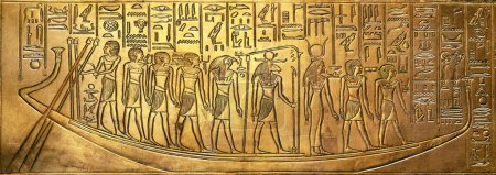 Bas relief with egyptian gods on a boat from Tutankhamun tomb