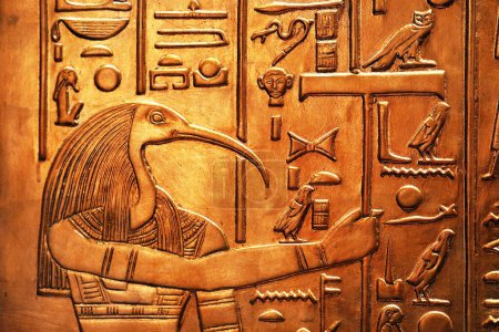 Photo for Ancient egyptian god depicted as a ibis-headed man from Tutankhamun tomb - Royalty Free Image