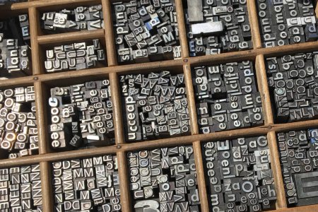 Metal type sorts in a typographical drawer