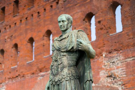 Photo for Turin, Italy - October 05. 2023: Bronze statue of Julius Caesar in front of the Porta Palatina in Turin in the Piedmont region of Italy. Roman Empire in northern Italy. - Royalty Free Image