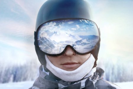 Photo for A mountain range reflected in the ski mask. Winter Sports.Wearing ski glasses. - Royalty Free Image